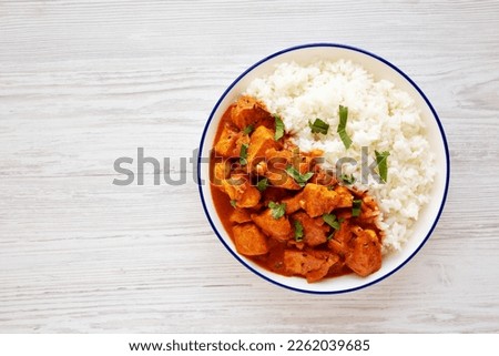 Homemade Easy Indian Butter Chicken with Rice on a Plate, top view. Flat lay, overhead, from above. Space for text. Royalty-Free Stock Photo #2262039685