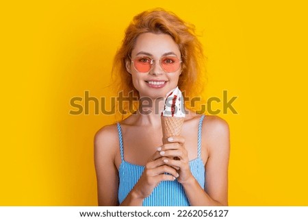 glad woman with cone icecream on background. photo of woman with cone icecream