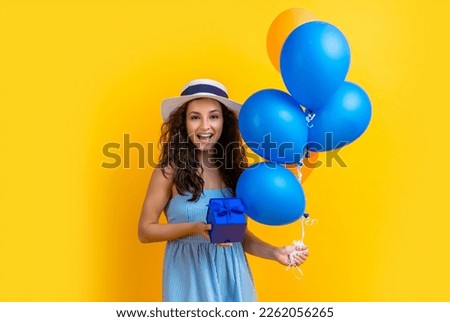 glad birthday woman with gift balloons in studio. birthday woman with gift balloons
