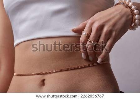 close up of boho styled woman with silver jewelry