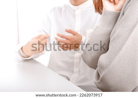 Men and women having a discussion Royalty-Free Stock Photo #2262073917