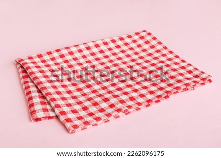 top view with red empty kitchen napkin isolated on table background. Folded cloth for mockup with copy space, Flat lay. Minimal style. Royalty-Free Stock Photo #2262096175
