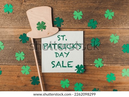 St.Patrick's day sale on wooden background