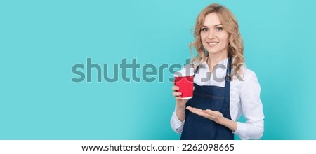 happy woman barista in cook apron drink takeaway coffee, barista. Woman isolated face portrait, banner with mock up copy space.