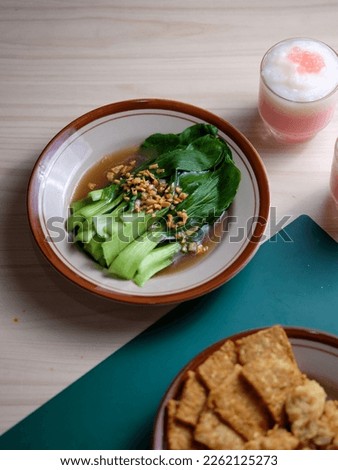 Dinner on the Table, Bak Choy, Fried Tempeh and Strawberry Puding Royalty-Free Stock Photo #2262125273