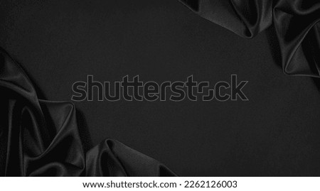 Black silk satin surface. Dark elegant background with space for design. Text or product. Table top view. Flat lay. Template. Empty. Creases in fabric. Folds.	
 Royalty-Free Stock Photo #2262126003