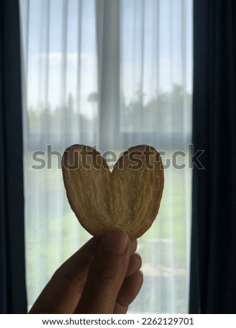 cute love shape from kind of snack as background