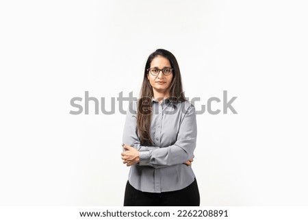 Happy successful Indian woman standing in casual outfit, confident, smiling pleased at camera Royalty-Free Stock Photo #2262208891