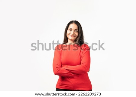 Happy successful Indian woman standing in casual outfit, confident, smiling pleased at camera Royalty-Free Stock Photo #2262209273