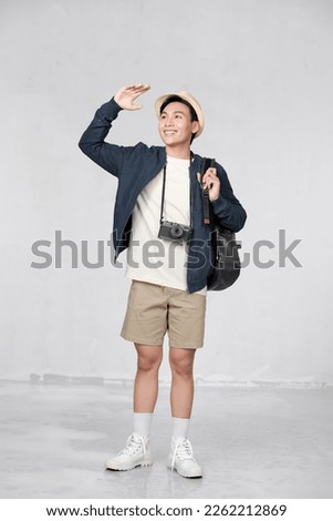 Portrait of young Asian man traveling Royalty-Free Stock Photo #2262212869