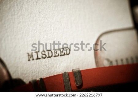 Misdeed word written with a typewriter. Royalty-Free Stock Photo #2262216797