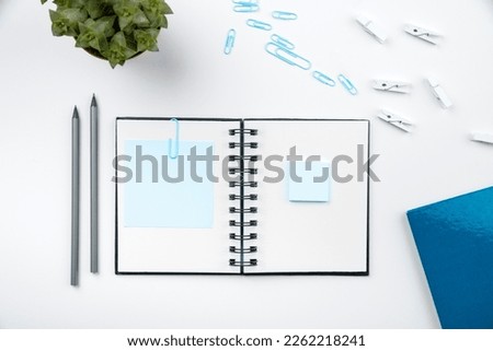 Image with school supplies, colored stickers, notebooks. Pens, pencils, rullers, calculator, keyboard. Assortment office items. Important information written on paper.