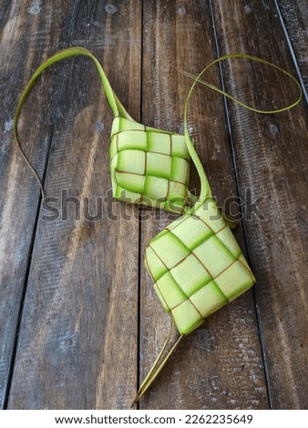 Ketupat (Rice Dumpling) On dark Background. Ketupat is a natural rice casing made from young coconut leaves for cooking rice during eid 