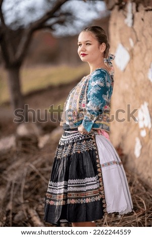 Young beautiful slovak woman in traditional dress. Slovak folklore