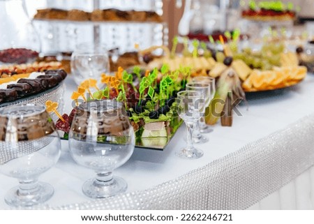 A colorfully decorated table scape awaiting guests for an al fresco dinner Royalty-Free Stock Photo #2262246721