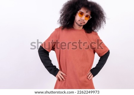 Portrait with sunglasses smiling. Young boy with afro hair on white background