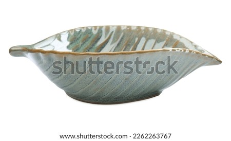 Beautiful green leaf shaped ceramic bowl on white background