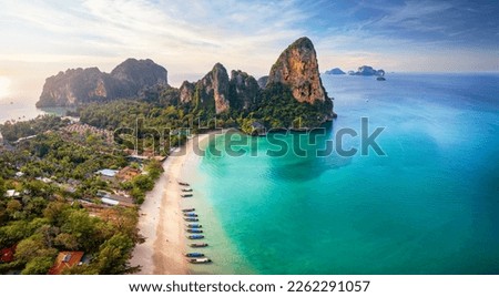 Panoramic aerial view of the beautiful Railay beach, Krabi, Thailand, lush rain forest and emerald sea during morning sunrise without people Royalty-Free Stock Photo #2262291057