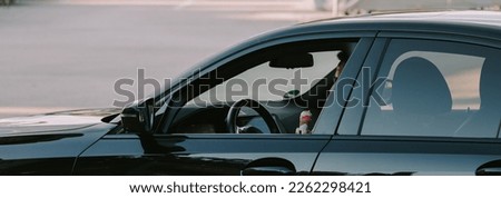 Man driving a luxurious vehicle