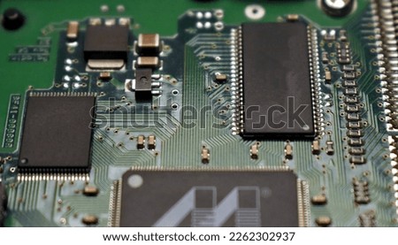 microprocessors on a green circuit board, close up detailed picture of future technology