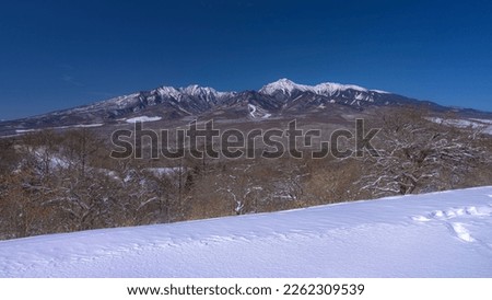 This is a winter landscape of Mt. Yatsugatake from Minamimaki village in Nagano prefecture, Japan.
This village is near Kiyosato highland, which is well known as a tourist destination in this area.