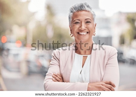 Portrait, city business and woman with arms crossed in Colombia, town and travel commute. Happy manager, mature female and smile in urban street for executive leadership, professional trust and goals Royalty-Free Stock Photo #2262321927