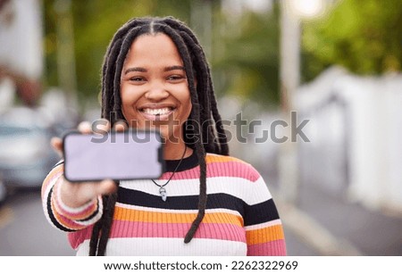 Mockup, phone and screen, portrait and black woman in road for travel, advertising and copy space. Face, smartphone and display by student traveling, connect or social media app on blurred background
