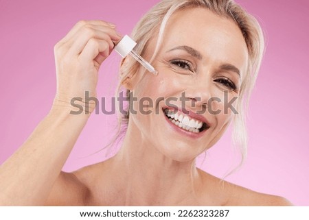 Beauty, skincare and portrait of woman with oil for face, dermatology and cosmetics in studio. Happy aesthetic person on pink background for collagen, self care and spa facial results for wellness