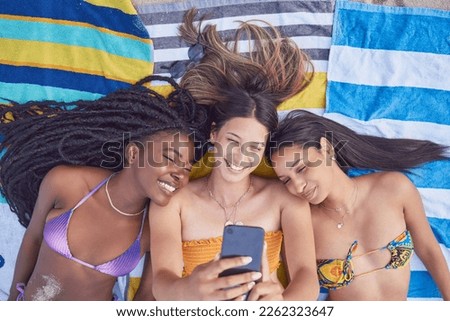Beach selfie, girl friends and happiness by the sea lying on a towel feeling freedom with a smile. Summer, students and girls in Miami taking profile picture for social media in summer at ocean