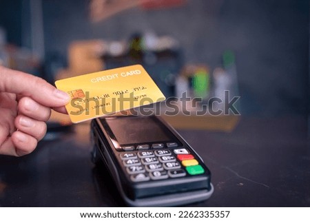 Mockup Credit card machine for money transaction payment.Moment of payment with a credit card through terminal.vintage style