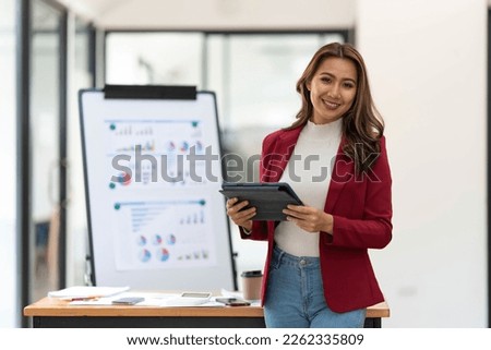 Asian Business woman working at home office and analyze financial report document. Accounting and Finance concept Royalty-Free Stock Photo #2262335809