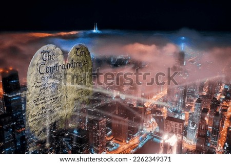 Ten Commandments shinning the light of truth around the city religious background  Royalty-Free Stock Photo #2262349371