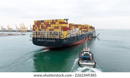 cargo container ship and tugboat sailing in sea to import export goods transportation and commercial port background,  photography rear view from drone,
