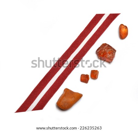 Latvia's flag ribbon and amber pieces