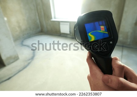 thermal imaging camera inspection for temperature check and finding heating pipes in floor Royalty-Free Stock Photo #2262353807