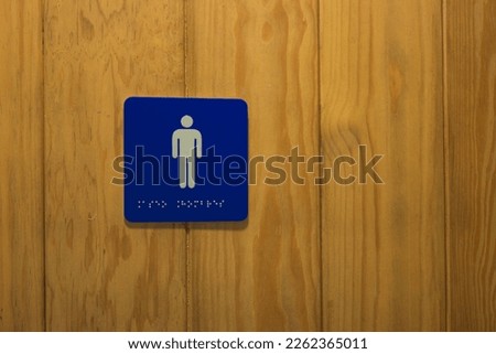 Women's and men's restroom signs.