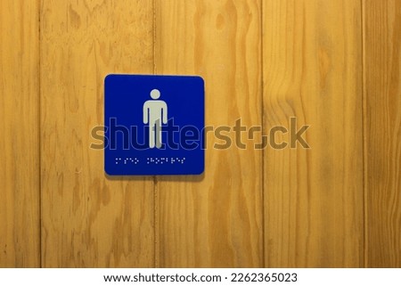 Women's and men's restroom signs.