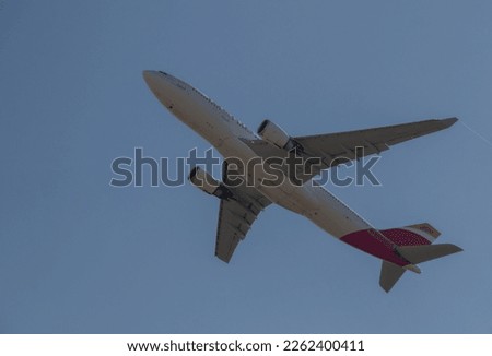 Plane ascending into the sky, flying, on its takeoff from the airport