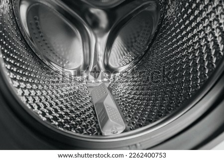 Kind in a washing machine drum Royalty-Free Stock Photo #2262400753