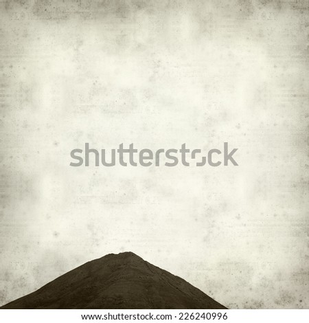 textured old paper background with Tindaya, sacred mountain of Fuerteventura