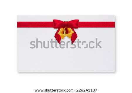 White paper card with a red bow and bell on a white background.