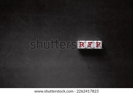 There is white cube with the word RFP. It is an abbreviation for Request For Proposal as eye-catching image. Royalty-Free Stock Photo #2262417823