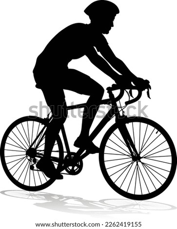 Bicyclist riding their bike and wearing a safety helmet in silhouette Royalty-Free Stock Photo #2262419155