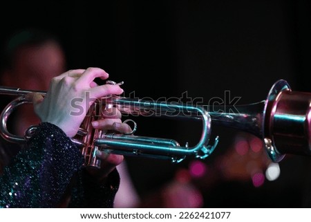 Playing a trumpet musical instrument close up