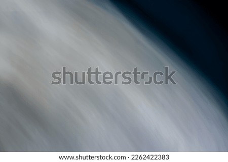 Abstraction of the surface of the moon. Beautifully blurred background banner in gray and dark colors. Backdrop