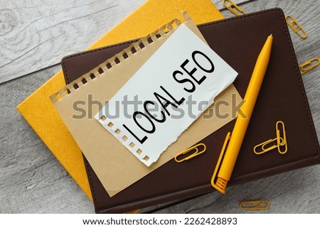 Local Seo text on torn paper. notepad paper. Concept meaning incredibly effective way to market your near business online.