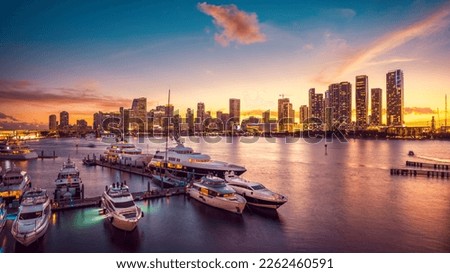 the skyline of miami during sunset with a marina