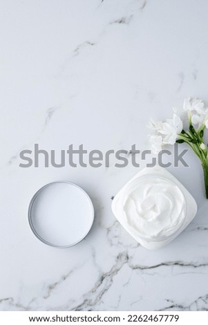 White cosmetic jar on the water surface. Summer water pool fresh concept
