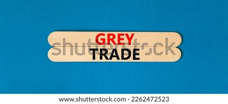 Grey trade symbol. Concept words Grey trade on wooden sticks. Beautiful blue table blue background. Business grey trade concept. Copy space.