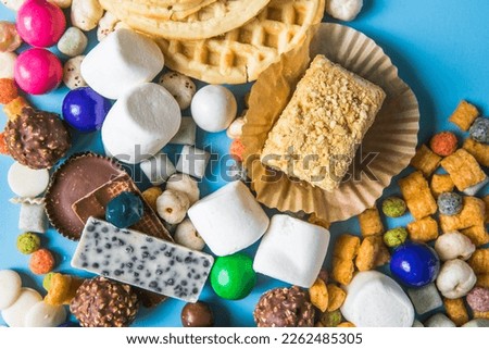 Unhealthy products. food bad for figure, skin, heart and teeth. Assortment of fast carbohydrates food with candy